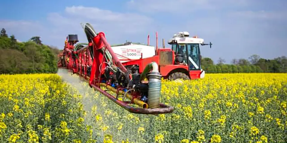 Crop sprayer in field